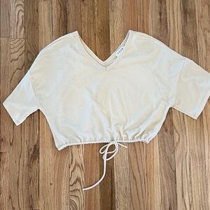 ACOA Cream V-Neck Cropped Tee.